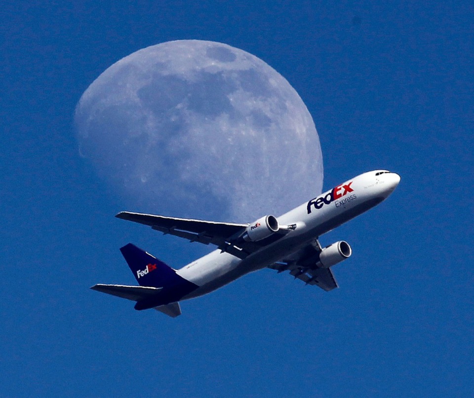 <strong>In this Sunday, July 26, 2015, file photo, a FedEx cargo airplane passes over Whittier, Calif., on its way to Los Angeles International Airport.</strong> (Nick Ut/AP file)