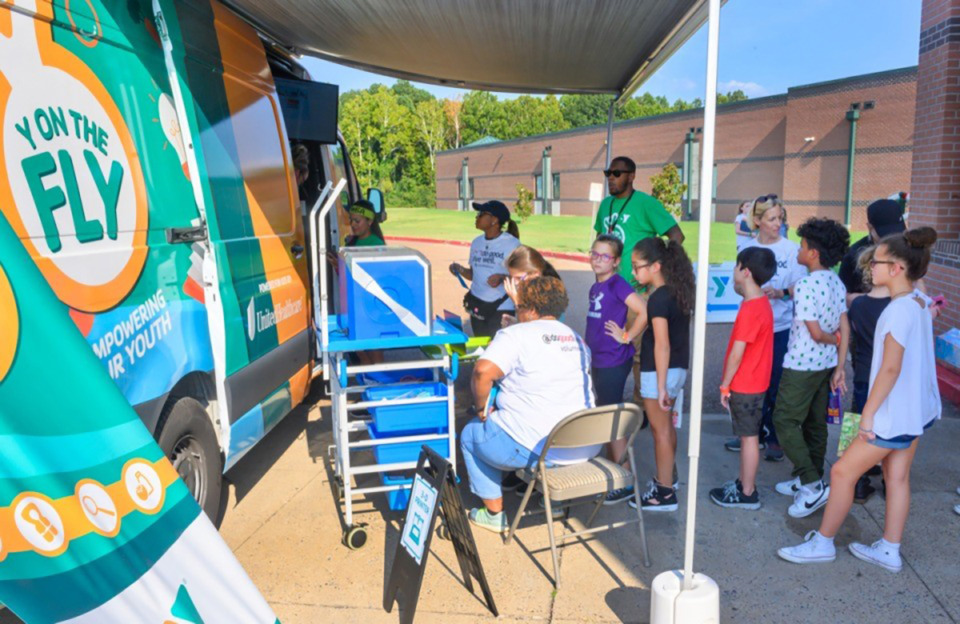 <strong>Children from the after-school program at Millington Elementary school line up to use the 3-D printer at the "Y on the Fly" event with the YMCA and UnitedHealthcare at Millington Elementary School Sept. 9, 2019.&nbsp;The YMCA of Memphis and the Mid-South announced plans to expand its services in North Mississippi.</strong> (Greg Campbell/Special to The Daily Memphian)