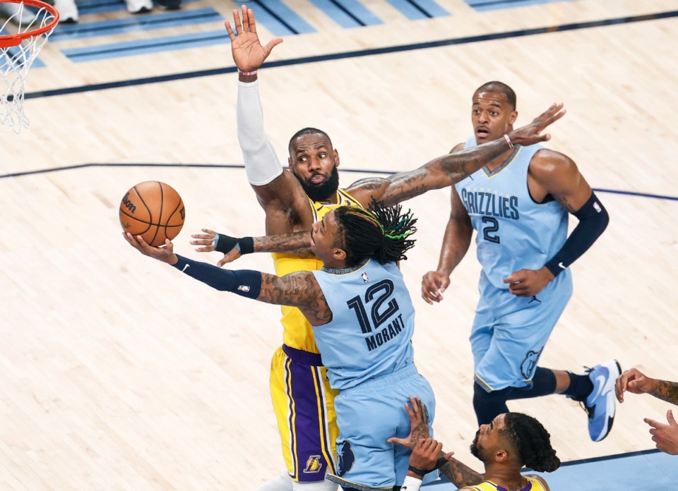 <strong>Memphis Grizzlies guard Ja Morant (front) drives to the basket against Los Angeles Lakers forward LeBron James on Wednesday, April 26, 2023.</strong> (Mark Weber/The Daily Memphian)