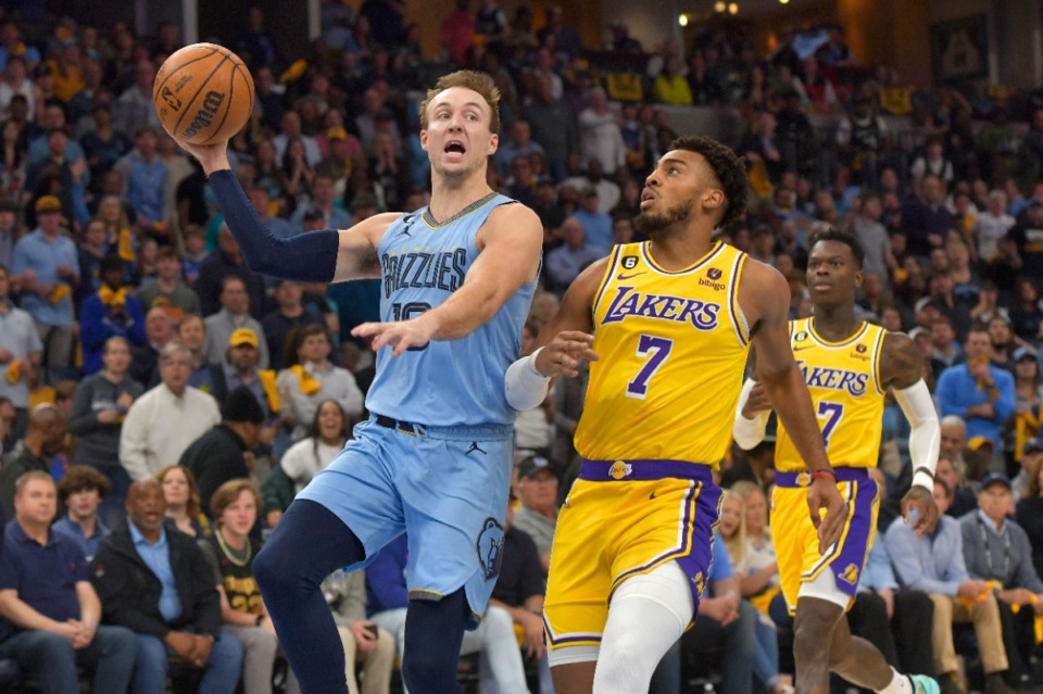 <strong>Memphis Grizzlies guard Luke Kennard (10) is defended by Los Angeles Lakers forward Troy Brown Jr. (7) on Wednesday, April 26, 2023.</strong> (Brandon Dill)/AP)