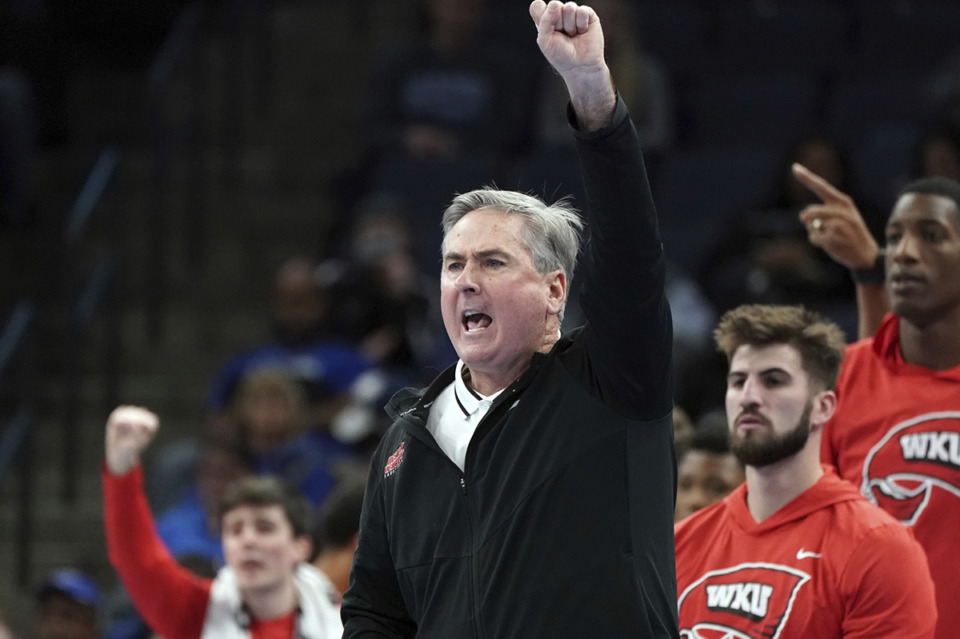 <strong>Western Kentucky's head coach Rick Stansbury reacts in the second half of an NCAA college basketball game against Memphis Nov. 19, 2021, in Memphis. Tigers coach Penny Hardaway has added Stansbury to his coaching staff.</strong>&nbsp;(Karen Pulfer Focht/AP file)