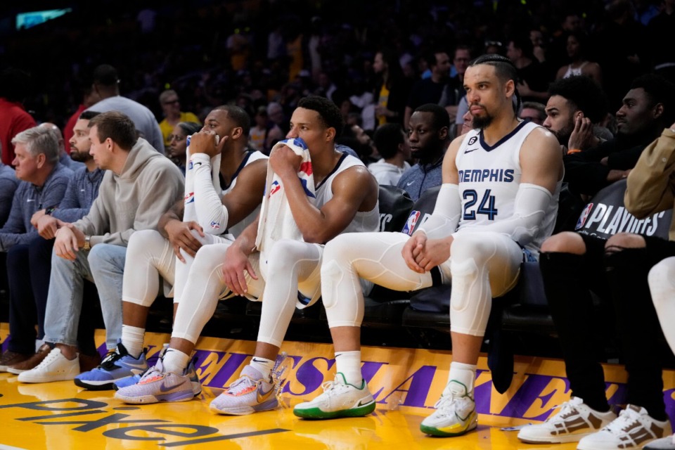 <strong>From right, Memphis Grizzlies' Dillon Brooks, Desmond Bane and Xavier Tillman Sr. watch from the bench during the second half of Game 6 in the team's first-round NBA basketball playoff series against the Los Angeles Lakers Friday, April 28, 2023, in Los Angeles.</strong> <strong>The Lakers won 125-85.</strong> (Jae C. Hong/AP)