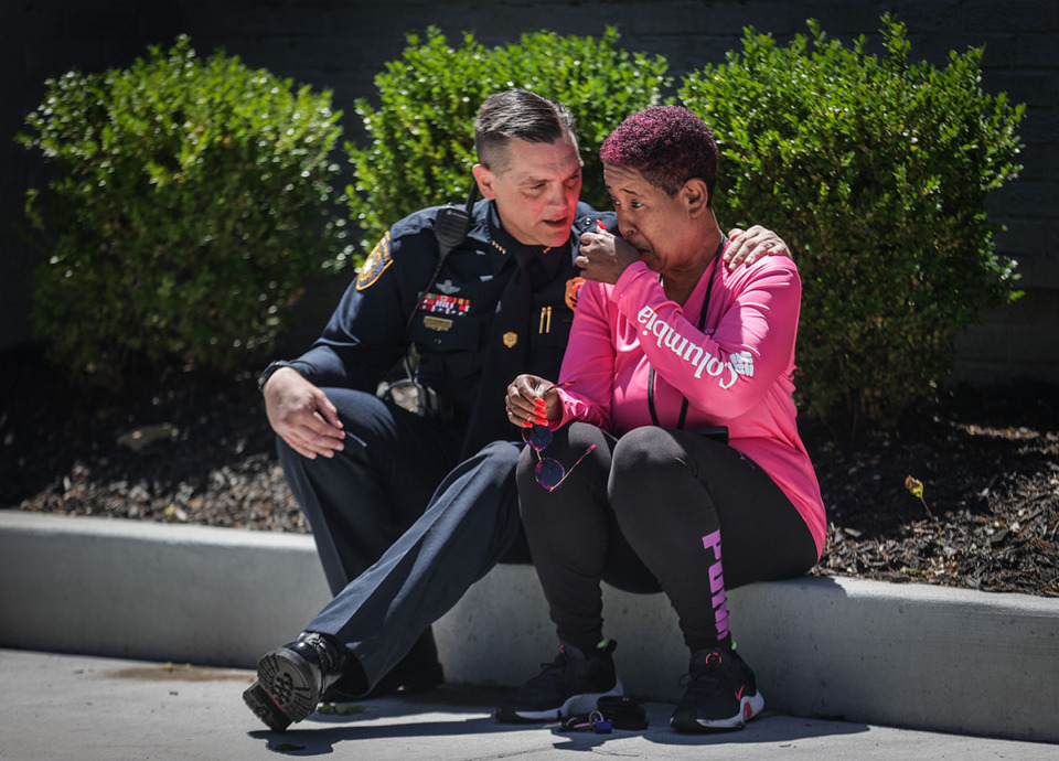 <strong>Memphis Police Department deputy chief Stephen Chandler comforts, Marsha McKinney,&nbsp;who identified herself as the suspect&rsquo;s mother, after&nbsp;an active shooter situation near the University of Memphis Tuesday, May 2. McKinney&nbsp;told reporters at the scene that she hasn&rsquo;t spoken to her son in months.</strong> (Patrick Lantrip/The Daily Memphian)