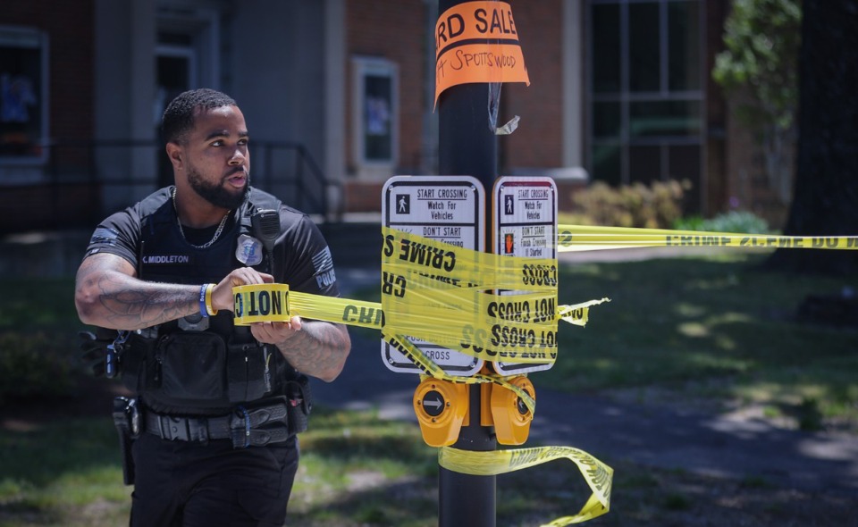 <strong>Memphis Police officers extend the crime-scene tape near the University of Memphis on May 2, 2023.</strong> (Patrick Lantrip/The Daily Memphian)
