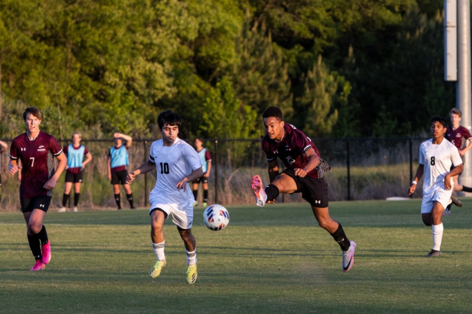 <strong>Houston and Collierville soccer players chase the ball up the pitch on Wednesday, May 3, 2023.</strong> (Brad Vest /Special to The Daily Memphian)