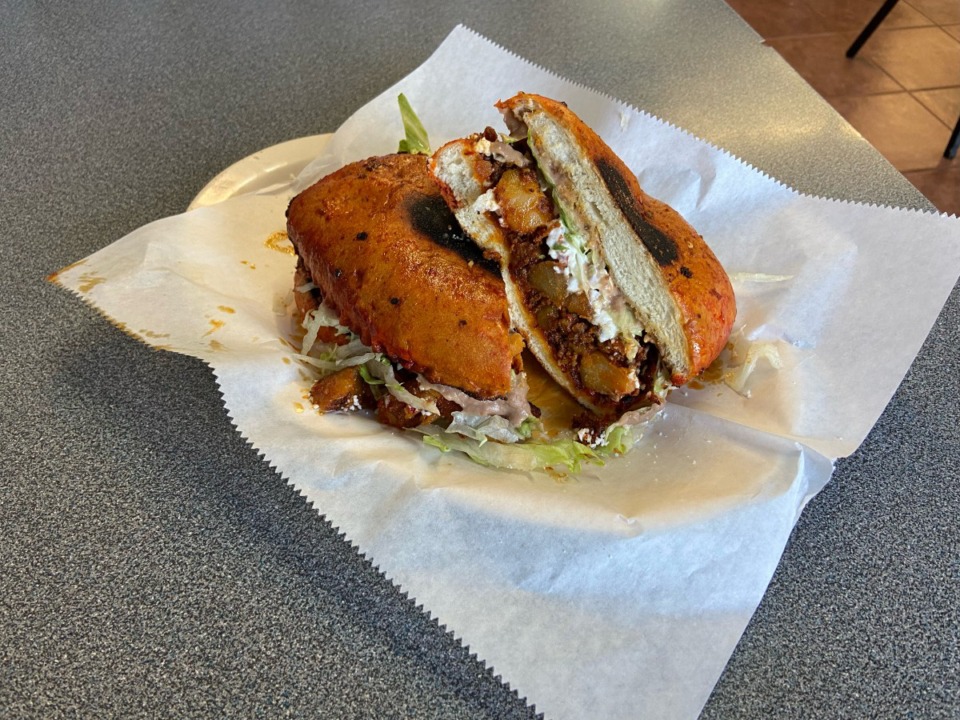 <strong>Garibaldi Taqueria&rsquo;s&nbsp;pambazos, a Mexican sandwich similar to a torta but filled with fried potatoes and chorizo, dipped in a guajillo chili sauce, and griddled. </strong>(Joshua Carlucci/Special to The Daily Memphian)