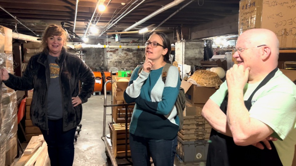 <strong>A. Schwab general manager Teri Cox works with project consultant Caroline Carrico and Elliott Schwab. The store has digitized nearly 5,000 items from its basement archives.</strong> (Courtesy Mark Fleischer)