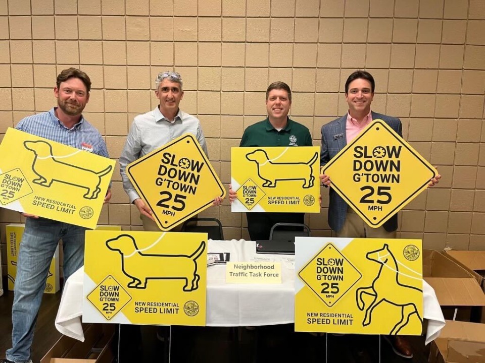 <strong>Members of Germantown&rsquo;s Neighborhood Traffic Task Force show off the new signs that are part of the suburb&rsquo;s &ldquo;Slow Down G&rsquo;town&rdquo; campaign. The effort is to remind drivers of the 25 mph speed limit on minor neighborhood streets.</strong> (Courtesy City of Germantown)