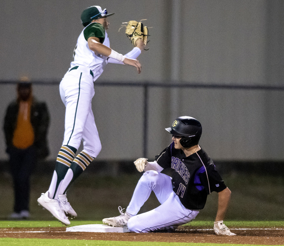 <strong>Briarcrest's Landon Rogers reaches for the ball as CBHS centerfielder Boston Barker slides into third.&nbsp;</strong>(Greg Campbell/Special to The Daily Memphian)