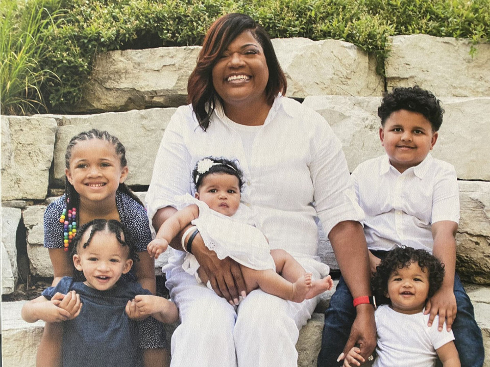 <strong>Xavier Tillman Sr.'s daughter Ayanna (left, back) and son Xavier Jr. (left, front) pose with their grandmother Tanya Powell-May (middle) and their cousins. Powell-May played basketball at the&nbsp;University of Michigan.</strong>&nbsp;(Courtesy Tanya Powell-May)