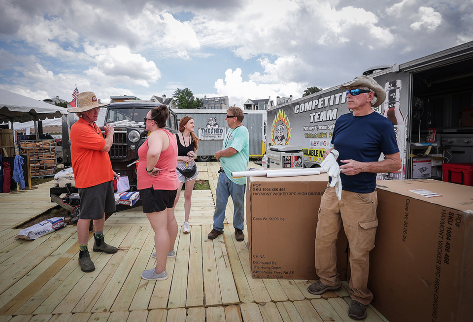 <strong>Brad Orrison (left) and the rest of The Shed's competition team get set up for the Memphis in May World Championship Barbecue Cooking Contest May 16.</strong> (Patrick Lantrip/The Daily Memphian)