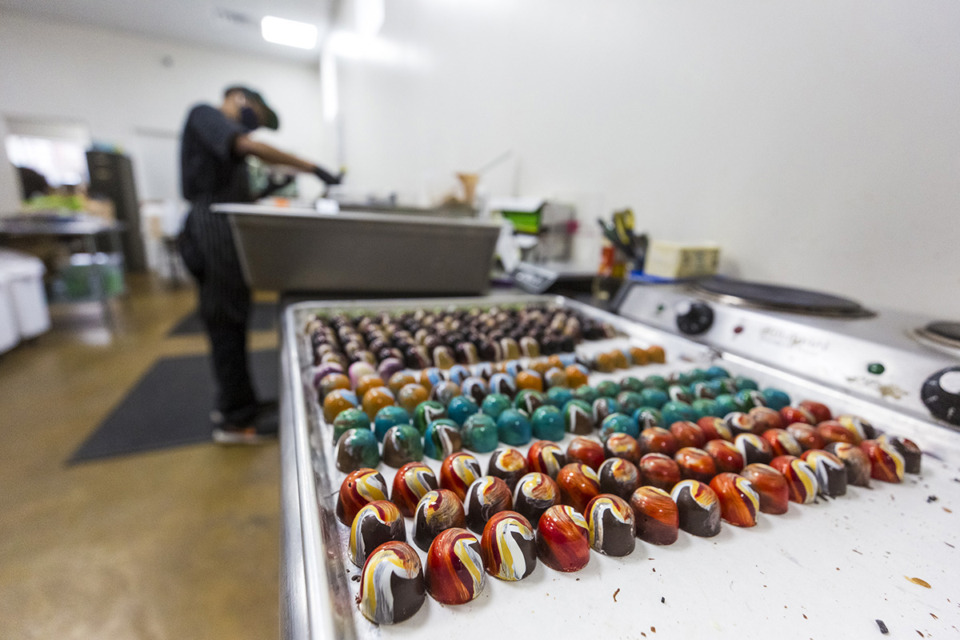 <strong>Martavious McGee prepares chocolates at Phillip Ashley Chocolates in Midtown Feb. 1, 2021.</strong> (The Daily Memphian file)