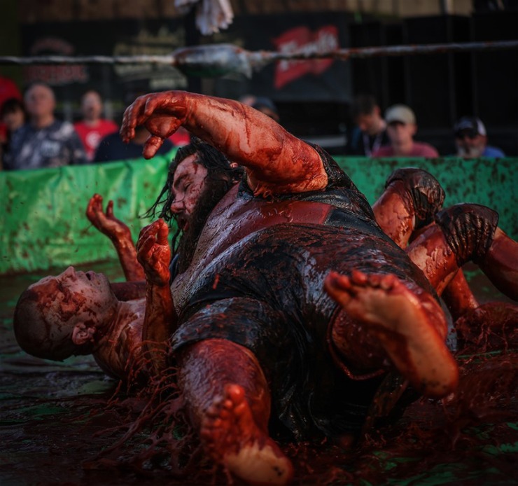 <strong>&ldquo;Big Sauce&rdquo; lives up to his nickname, slamming his opponent in The World Championship Barbecue Cooking Contest&rsquo;s Sauce Wrestling event May 17, 2023.</strong> (Patrick Lantrip/The Daily Memphian)
