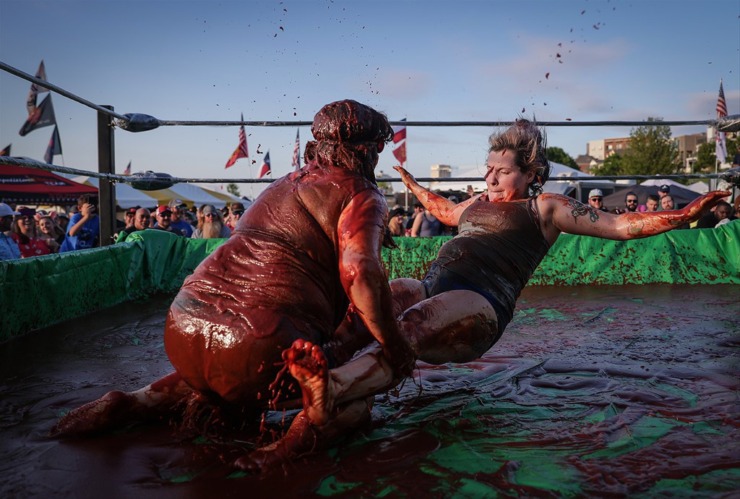 <strong>The red stuff may taste good, but it makes for poor footing in The World Championship Barbecue Cooking Contest&rsquo;s Sauce Wrestling event May 17, 2023.</strong> (Patrick Lantrip/The Daily Memphian)