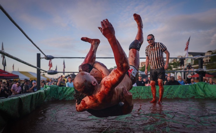 <strong>&ldquo;Big Sauce&rdquo; slams his opponent (somehow) in The World Championship Barbecue Cooking Contest&rsquo;s Sauce Wrestling event May 17, 2023.</strong> (Patrick Lantrip/The Daily Memphian)