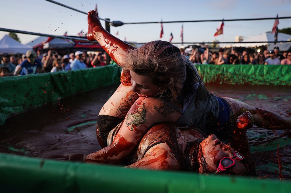 <strong>It&rsquo;s hard to tell who&rsquo;s who as someone gets pinned in The World Championship Barbecue Cooking Contest&rsquo;s Sauce Wrestling event May 17, 2023.</strong> (Patrick Lantrip/The Daily Memphian)