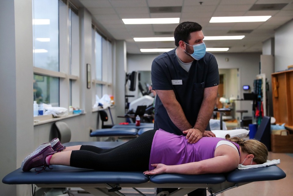 <strong>Physical therapist Justin Morris helped a long COVID patient with joint pain stemming from her long COVID-19 symptoms.</strong> (Patrick Lantrip/The Daily Memphian file)