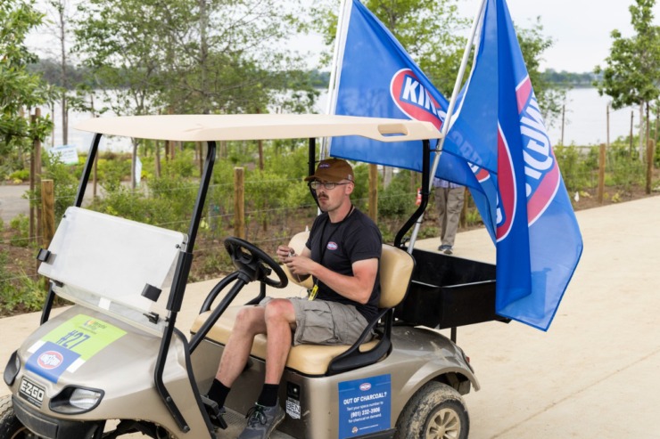 <strong>A golf cart displays charcoal flags in honor of barbecue contest May 19 at Tom Lee Park.</strong> (Brad Vest/Special to The Daily Memphian)