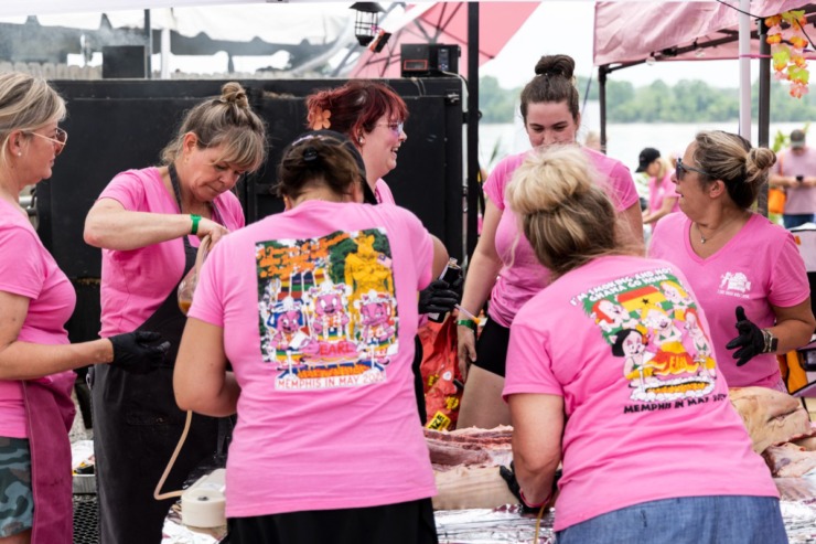 <strong>The I Only Smoke When I Drink team suffered a shortage of neither pink shirts nor pork shoulders at the Memphis in May World Championship Barbecue Cooking Contest at Tom Lee Park.</strong> (Brad Vest/Special to The Daily Memphian)