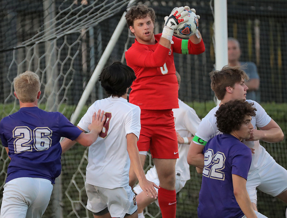 <strong>ECS goalie Chandler Caughron traps a corner kick during Evangelical Christian School's 3-0 win over Christ Presbyterian Academy in the Division 2-A finals at Spring Fling in Murfreesboro on May 22, 2019. The victory marks ECS' third soccer championship.</strong>&nbsp;(Jim Weber/Daily Memphian)