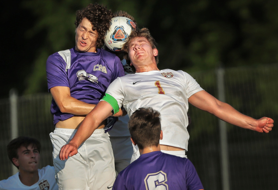<strong>ECS mifielder Max Pleban (1) tries to get control of a header under pressure by Harrison Rody (22) of Christ Presbyterian Academy during Evangelical Christian School's win in the Division 2-A soccer finals at Spring Fling in Murfreesboro on May 22, 2019.</strong> (Jim Weber/Daily Memphian)