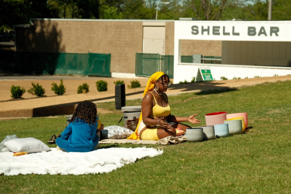 <strong>Healing Panther (center) does reiki at the Overton Park Shell.</strong> (Damien Lamoine/Courtesy Overton Park Shell)