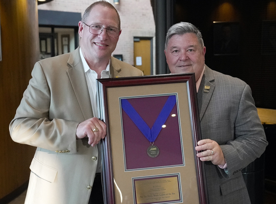 <strong>American Public Works Association past President Stan Brown (right) hands a top 10 public works leader award to Bo Mills, Germantown public works director.</strong> (Courtesy City of Germantown)