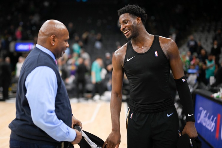 Memphis Grizzlies' Jaren Jackson Jr., right, speaks with his father, former NBA player Jaren Jackson Sr. after an NBA basketball game against the San Antonio Spurs, Friday, March 17, 2023, in San Antonio. Memphis won 126-120 in overtime. (AP Photo/Darren Abate)