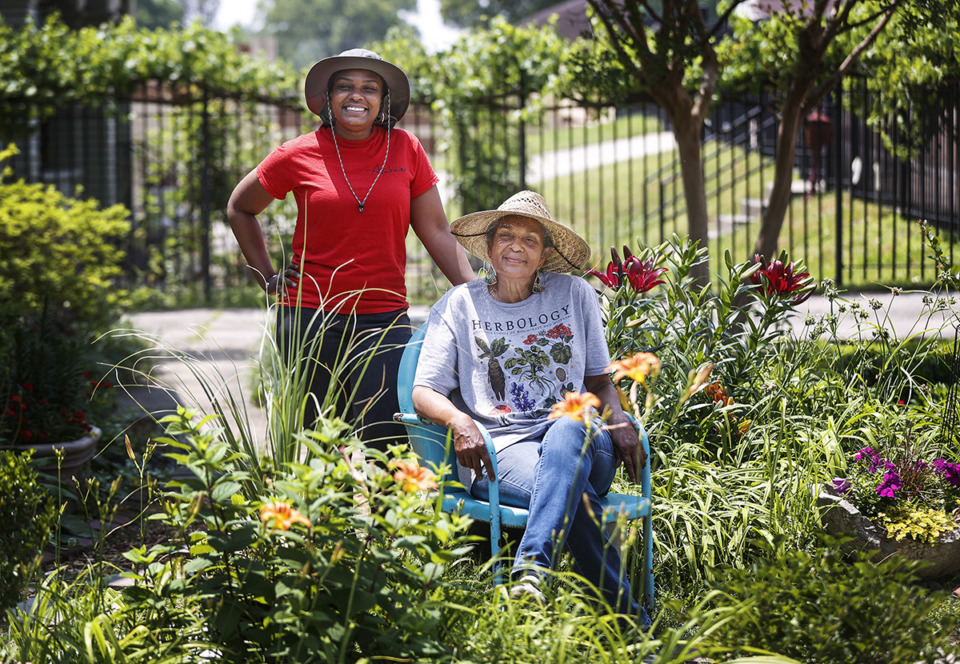 <strong>Lauren Wells (left) and her mother Mary Kathryn live next to each other and love gardening together. Armed with a butter knife, Mary Kathryn was six months pregnant when she planted her first garden.</strong> (Mark Weber/The Daily Memphian)