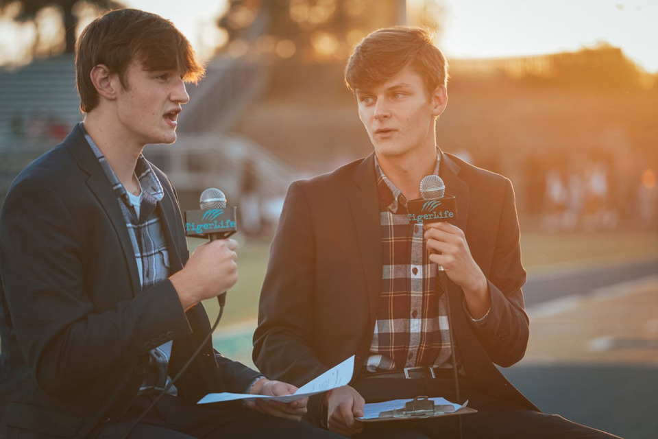 <strong>Arlington High School students Luke McBride, left, and Jake Stoope, right, live stream from a variety of sports events. Stoope received&nbsp;a $10,000 scholarship from the at the 2023 Sports Emmy Awards.</strong> (Courtesy Arlington High)