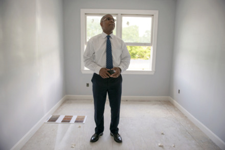 <strong>Knowledge Quest founder and CEO Marlon Foster considers material samples for an apartment building being renovated adjacent to his organization's Green Leaf Learning Farm on May 21, 2019 in Memphis, Tenn.</strong> (Brandon Dill/Special To The Daily Memphian)