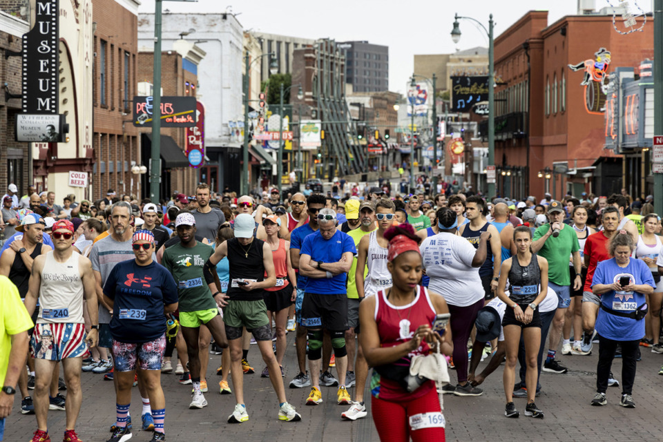 <strong>Runners line up at the half-marathon start on Beale Street on Saturday, May 27, 2023. The Great American River Run kicked off Memorial Day weekend in Memphis.</strong> (Brad Vest/Special to The Daily Memphian)