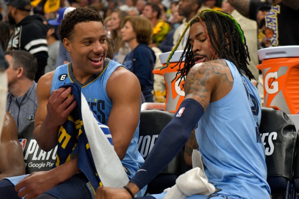 <strong>Memphis Grizzlies guards Desmond Bane, left, and Ja Morant joke on the bench on April 26, 2023.</strong> (Brandon Dill/AP)
