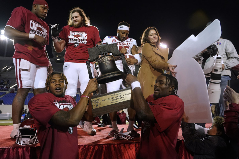 <strong>Arkansas players hoist the trophy after a three-overtime win over Kansas in the Liberty Bowl NCAA college football game Wednesday, Dec. 28, 2022, in Memphis. Arkansas won 55-53.&nbsp;The 2023&nbsp;Liberty Bowl game will be&nbsp;at 2:30 p.m. on Friday, Dec. 29.</strong> (Rogelio V. Solis/AP Photo file)