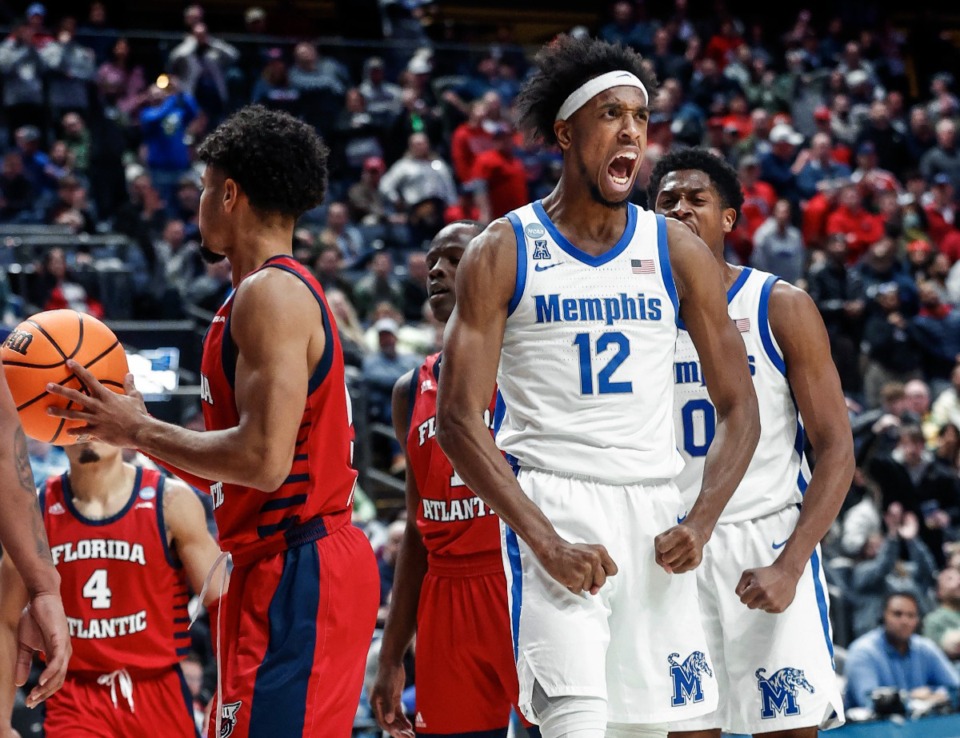 <strong>University of Memphis forward DeAndre Williams (middle) celebrates a made basket while being fouled by the Florida Atlantic University defense during action in their NCAA tournament game on Friday, March 17, 2023 in Columbus, Ohio. Williams hopes a reconsideration of his collegiate eligibility will allow him to play another season.</strong> (Mark Weber/The Daily Memphian file)