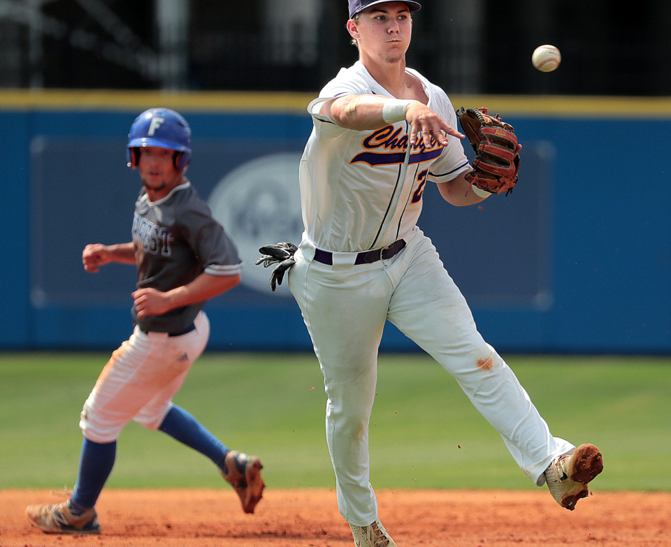 <strong>Covington's Austin Baskin throws to first after fielding an infield hit during Covington's 11-1 win over Forrest in the Spring Fling Class AA state title game at MTSU in Murfreesboro on May 24, 2019. The win marks Covington's first title since 2006.</strong>&nbsp;(Jim Weber/Daily Memphian)