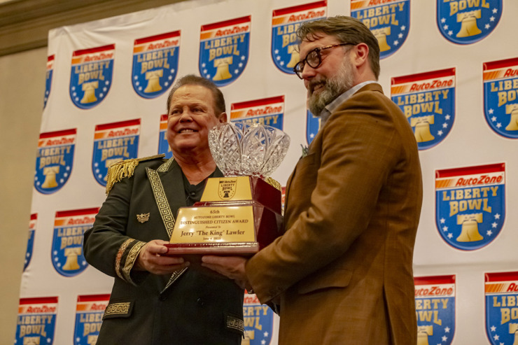 <strong>Jerry "The King" Lawler receives the 2023 AutoZone Liberty Bowl&rsquo;s Distinguished Citizen Award from Liberty Bowl President Hugh Mallory June 4.</strong> (Ziggy Mack/Special to The Daily Memphian)