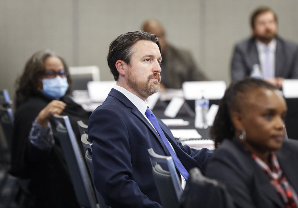 <strong>Shelby County Commissioner Mick Wright (middle) attends a consolidation discussion with Memphis City Council members and county commissioners Dec. 9, 2021, at the Renasant Convention Center.</strong> (Mark Weber/The Daily Memphian file)