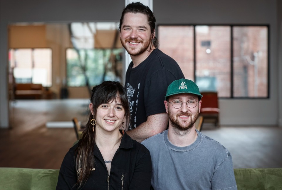 <strong>Comeback Coffee co-owners Amy and Hayes McPherson (seated) along with chief operations officer Ethan McGaughy, sit in their new headquarters Monday, June 5, 2023.</strong> (Mark Weber/The Daily Memphian)