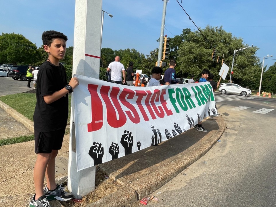 <strong>Protesters hold signs at Poplar Avenue and Highland Street on Friday, June 9, demanding justice for Jamil Ibrahim, who was arrested after an altercation with police in May. (</strong>Julia Baker/The Daily Memphian)