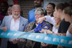 <strong>Greater Memphis Chamber's Ted Townsend (left) looks on with Terri Bosby (center) as she superivises her 50th ribbon cutting of the year at Rumble Boxing June 9.</strong> (Patrick Lantrip/The Daily Memphian)