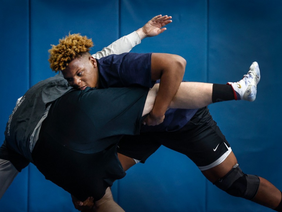 <strong>MUS football player and wrestler Dion Stutts (right) died Tuesday night.</strong> (Mark Weber/The Daily Memphian file)