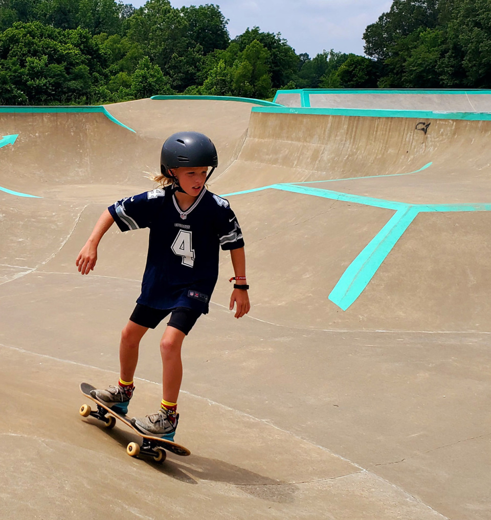 <strong>Dixon Alderman, 10, of Hernando, watches the curves in the concrete as he enjoys Hernando's skate park at Renasant Park.</strong> (Toni Lepeska/Special to The Daily Memphian)