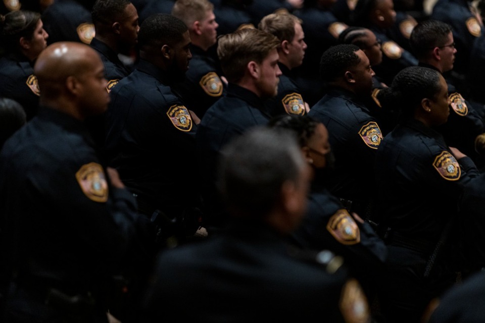 <strong>Graduates stand during the Memphis Police Department&rsquo;s graduation of its 137th recruit class of that included 104 graduates. MPD is working toward a goal of hiring 2,500 officers.</strong> (Brad Vest/Special to The Daily Memphian file)
