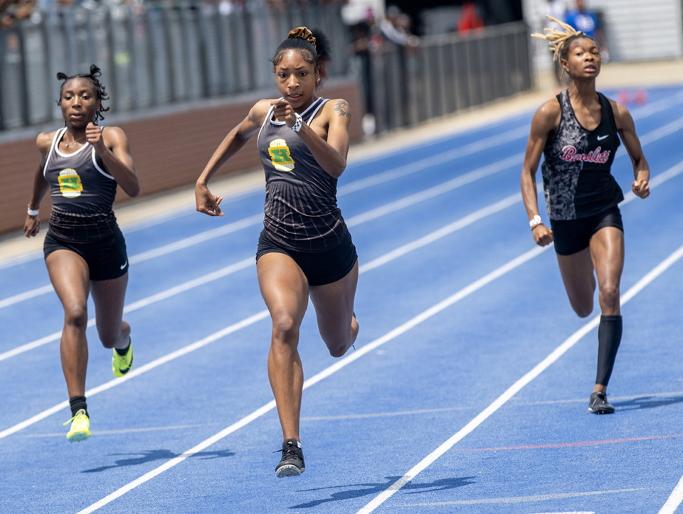 <strong>Jaitlyn Ware (center) of Central High School pulls away to win the girls 100 m dash at the TSSAA Section 4 AAA track championship Saturday, May 13, 2023 at Bartlett High School.</strong> (Greg Campbell/Special to The Daily Memphian file)
