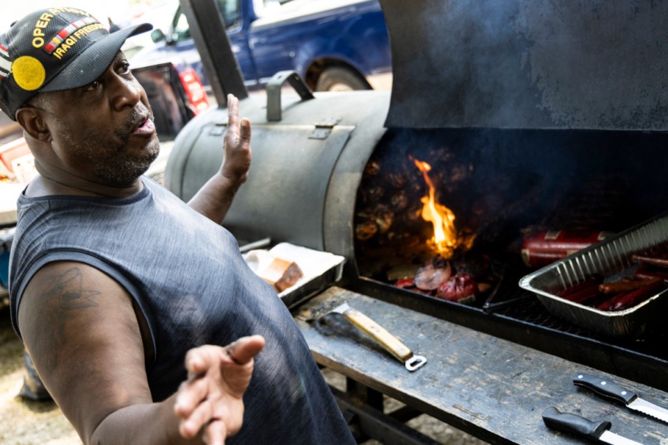 <strong>Military veteran Melvin Madison mans the grill Saturday during the 30th anniversary Juneteenth Douglass Freedom and Heritage Festival at Douglass Park in North Memphis.</strong> (Brad Vest/Special to The Daily Memphian)