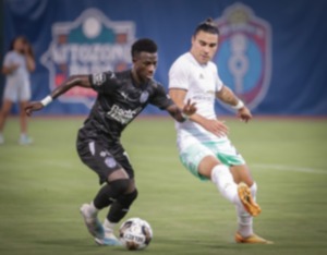 <strong>Memphis 901 FC midfielder Laurent Kissiedou (11) brings the ball up the pitch during a June 17, 2023 match against Detroit City FC.</strong> (Patrick Lantrip/The Daily Memphian)