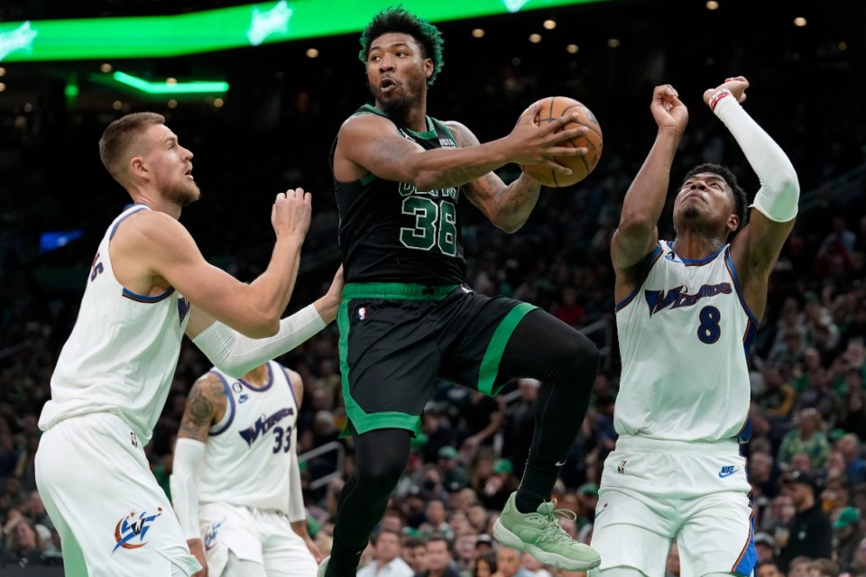 <strong>Marcus Smart is a former Defensive Player of the Year who is 6&rsquo;4&rdquo; and 220 pounds. (</strong>Steven Senne/AP file)