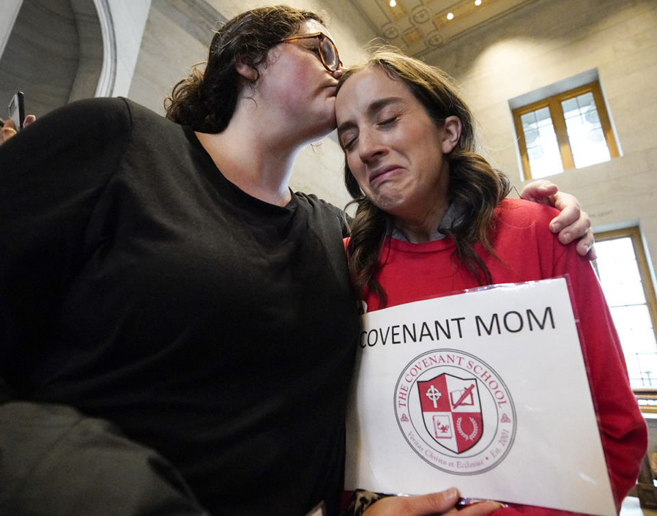 <strong>Ashley Cates comforts Sarah Neumann as she gets emotional talking about the Covenant School Shooting outside the House chamber April 6 in Nashville.</strong> (George Walker IV/AP file)