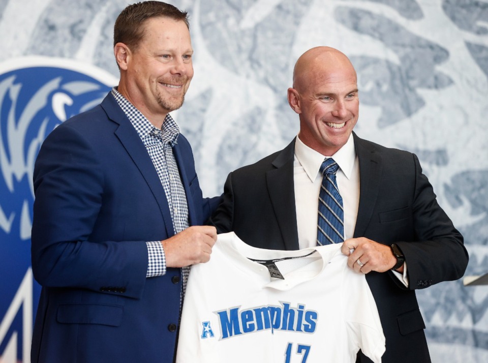 <strong>Laird Veatch (left) University of Memphis Athletic Director, introduces new baseball Coach Matt Riser (right) during a ceremony at Laurie-Walton Basketball Center on Thursday, June 22, 2023.</strong> (Mark Weber/The Daily Memphian)